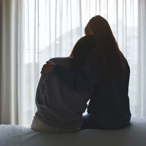 Sisters hugging